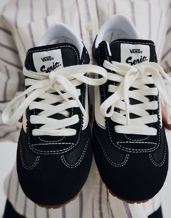 Close-up on a pair of black Super Lowpro shoes.