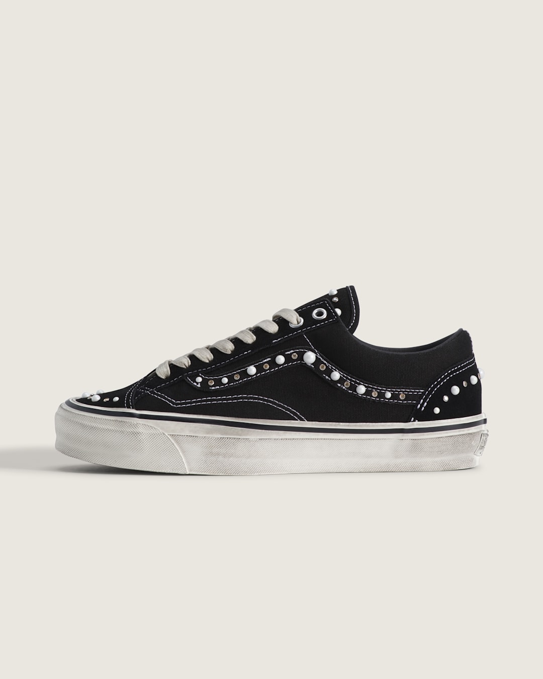 Studio shot of Vans Pearlized Black / Marshmallow White.