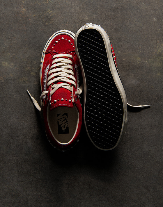 An overhead shot of the Racing Red Premium Old Skool 36 Pearlized colorway on a concrete floor.