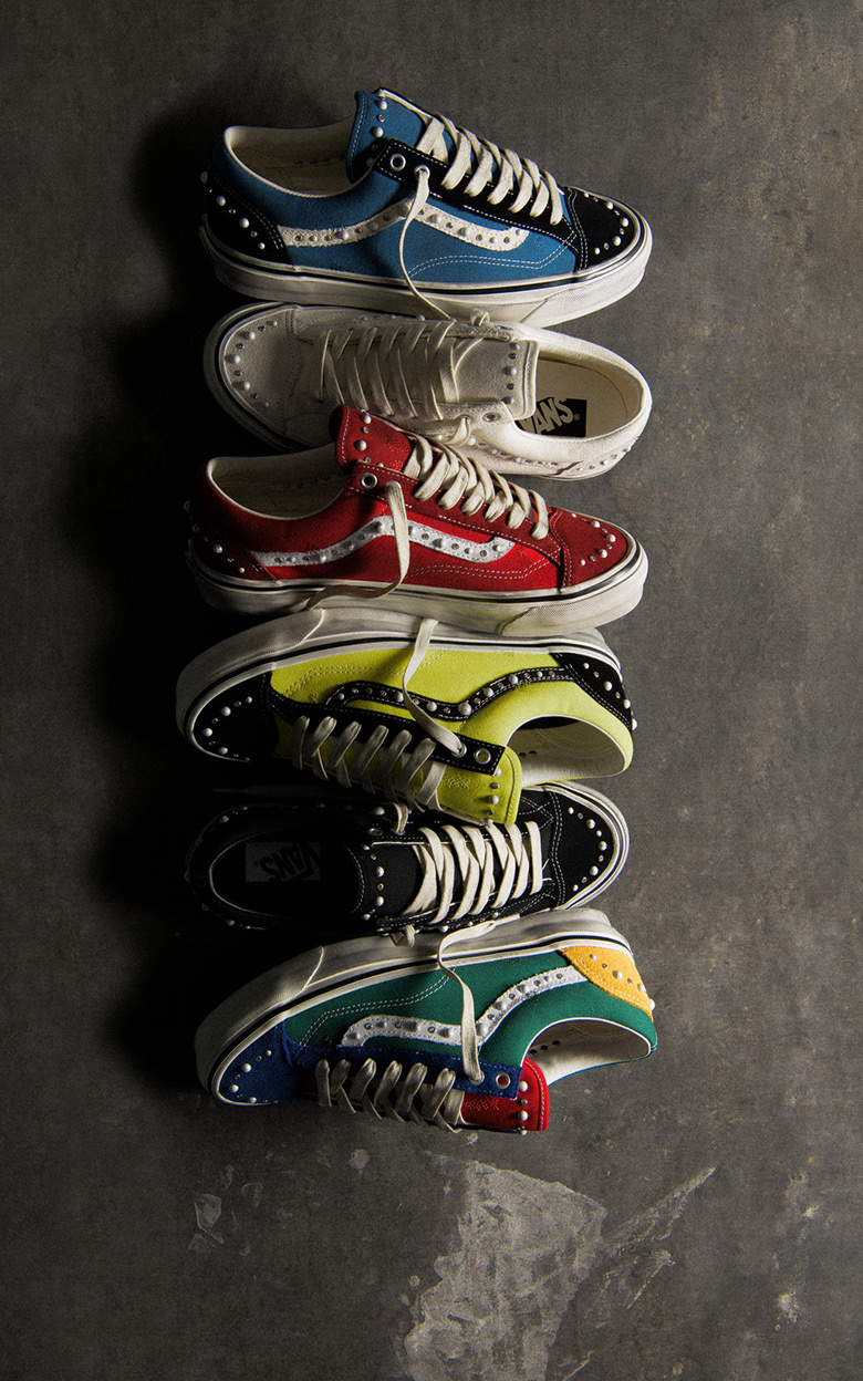Several colorways of the Premium Old Skool 36 Pearlized lie in a row on a concrete floor.