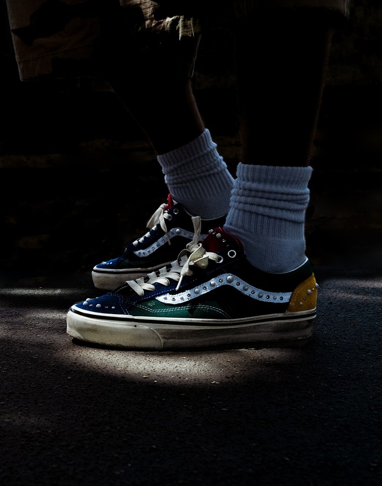 Close-up on someone wearing the multicolored Yacht Club colorway on the Premium Old Skool 36 Pearlized with white crew socks.