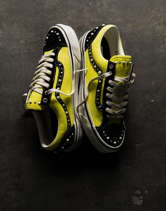 An overhead shot of the black and Fluro Lime Premium Old Skool 36 Pearlized colorway on a concrete floor.