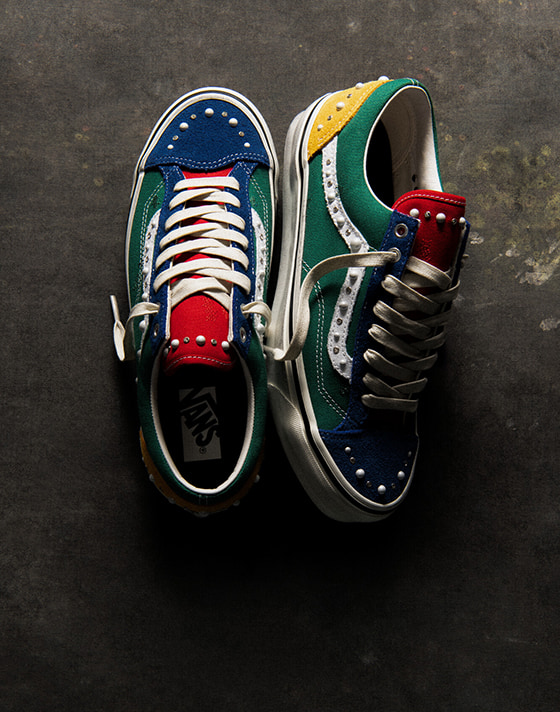 An overhead shot of the green/multi Premium Old Skool 36 Pearlized colorway on a concrete floor.