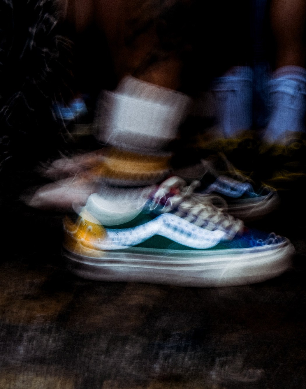 Close-up on someone wearing the multicolored Yacht Club colorway on the Premium Old Skool 36 Pearlized with white crew socks.