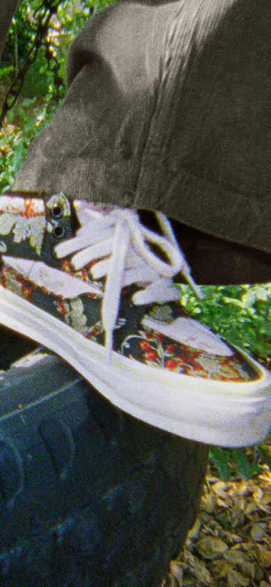 Image of the OTW Halfcab 33 Decon Vibram shoe on top of a black tire
