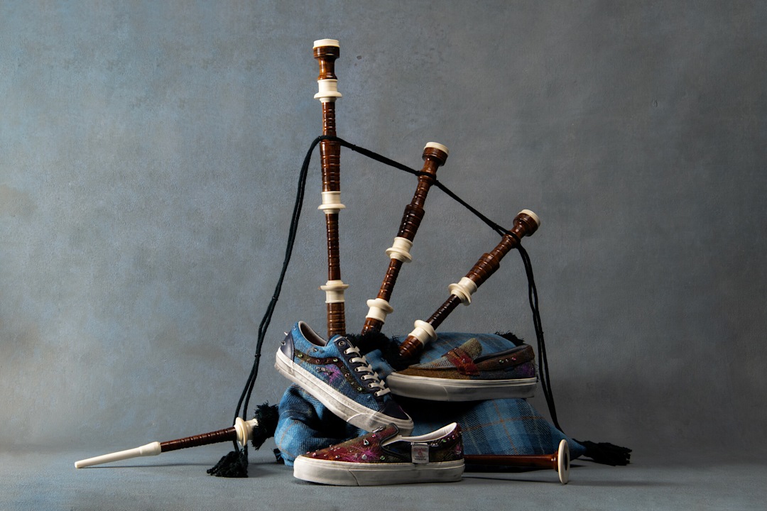 Studio picture of Vans x Harris Tweed shoe collection with bagpipes