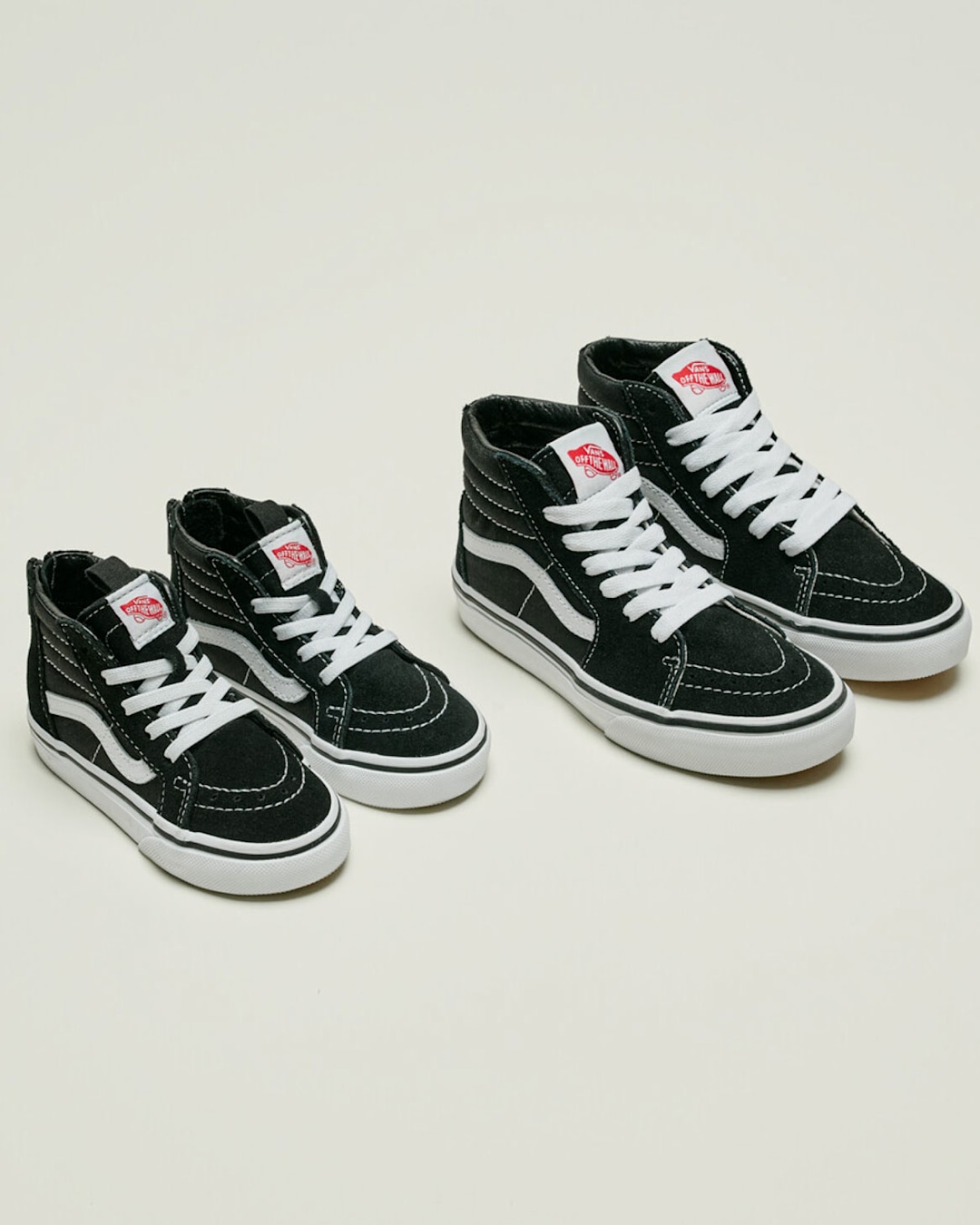 Black Vans Sk8-Hi shoes in adult and kids' sizes displayed side by side with the text "Matching Family."