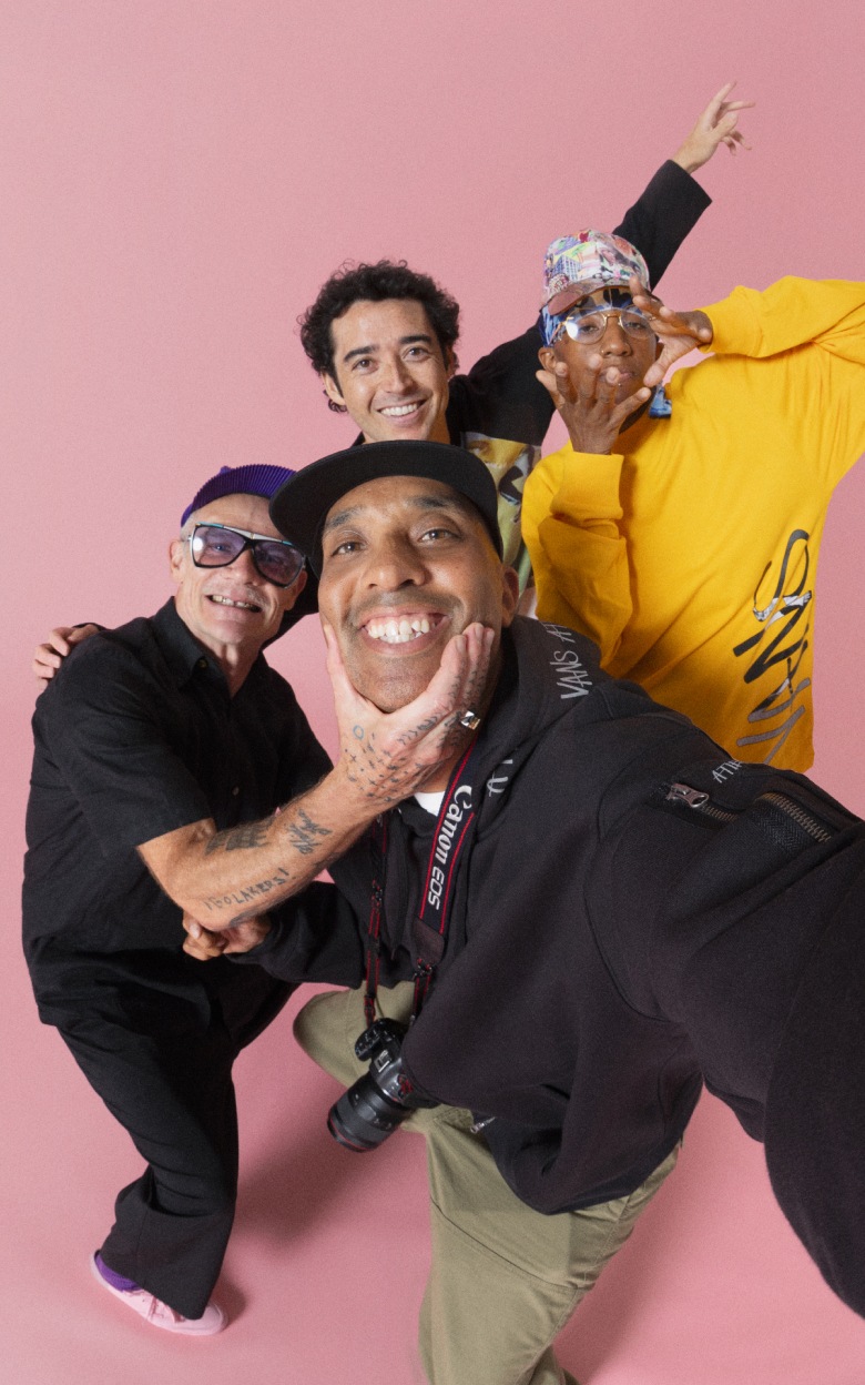 Atiba, Flea, Rowan Zorilla, and Lauren Halsey pose in a photo studio for the United Through Skateboarding collection.