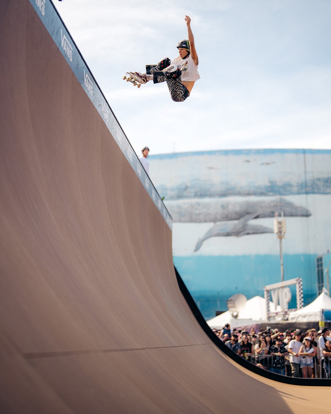 Vans skate athlete, Lizzie Armanto, skate boarding on a ramp at the Vans Warped Tour in Long Beach, CA in 2025.