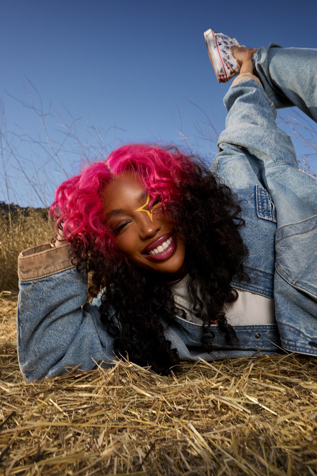 Up close photo of SZA smiling while wearing Vansza Denim Hunting Jacket and Multi-Pocket Denim Pant and Vansza Authentic Kickdown