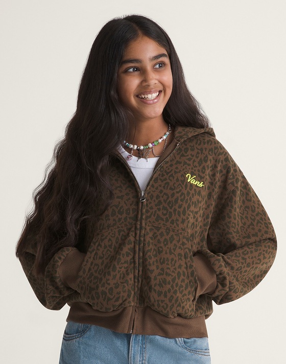 A young girl wearing a vintage cocoa brown Script Logo Full Zip in a photo studio.