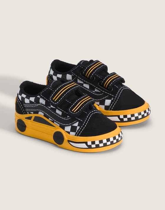 A pair of race car Toddler Old Skool V Shoe in a photo studio.