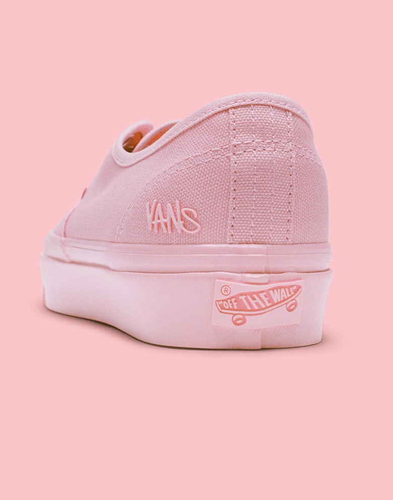 An Atiba pink Premium Authentic Shoe by Atiba from the United Through Skateboarding Collection against a warm pink background.