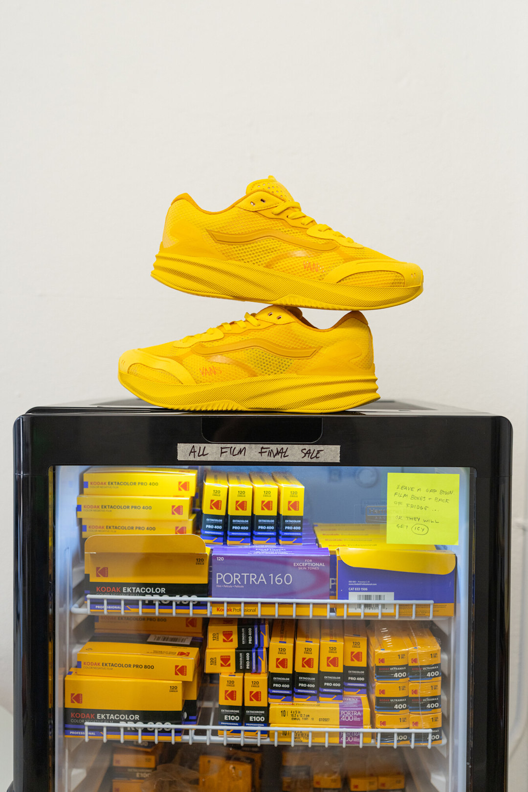 AVE Rapid LX™ “Atiba Gold” color shoe sitting on fridge filled with film rolls.