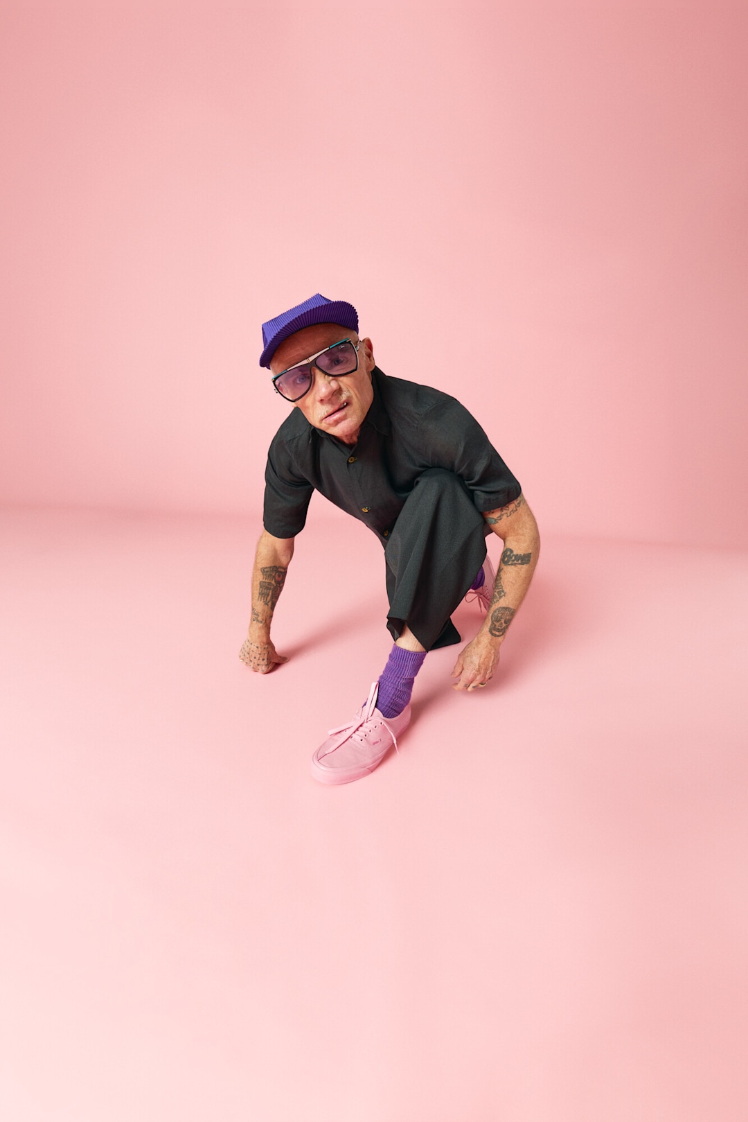 Flea wearing Vans x Atiba Cargo Pant in black and Premium Authentic Shoe in pink.