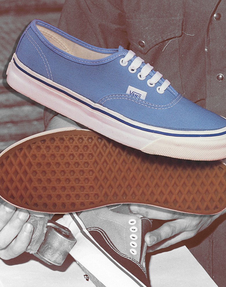 A pair of light blue Authentic shoes imposed on a black and white vintage photograph of someone making Authentic shoes.