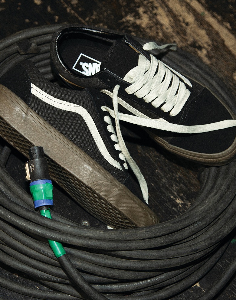 Black old skool shoe in a wire
