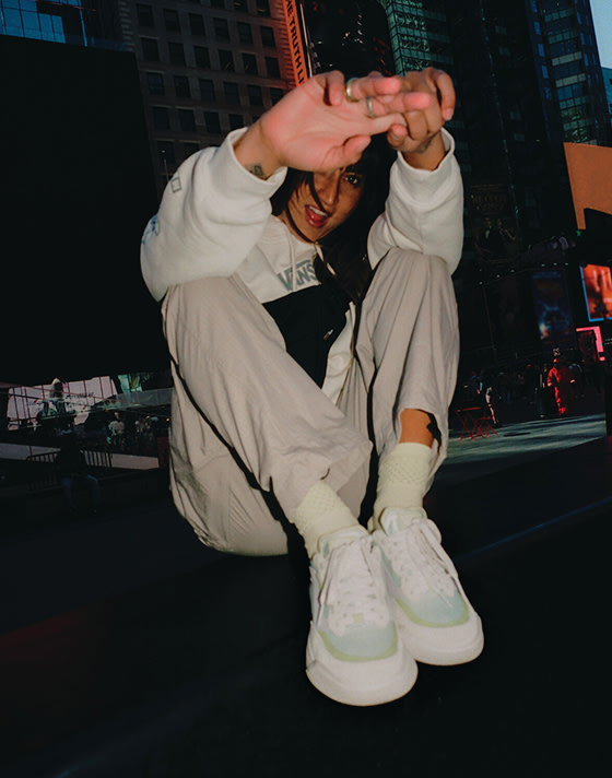 A woman sitting and smiling for the camera in the UltraRange 2.0.
