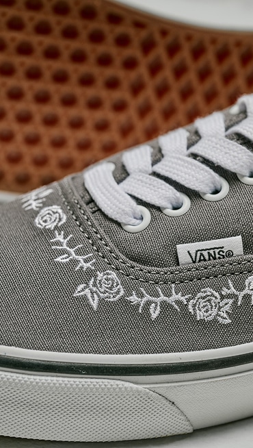 Extreme close-up of the Authentic Shoe in Pewter Grey with roses and thorns embroidered on the toe box.