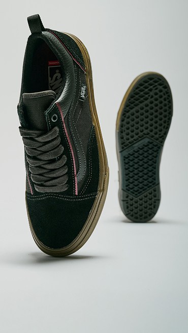 Medium shot of the Gum Black Skate Old Skool Wafflecup Shoes. One shoe up close showing off the top. The one in the back showing off the sole.