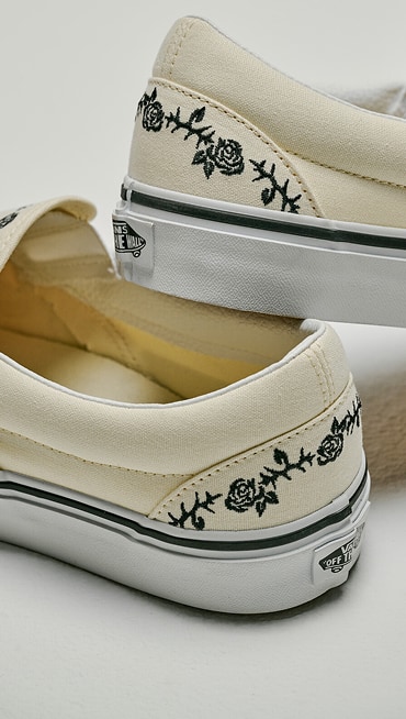 Close-up on the embroidered floral details on the heel of the Classic Slip-On.