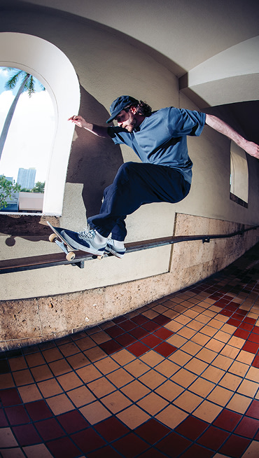 Vans Skate Team Rider Dick Rizzo grinds a rail against a wall wearing the Skate Era WaffleCup.