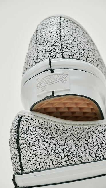 Close-up on the cracked texture on the Overpaint Blanc De Blanc Premium Authentic Shoe.