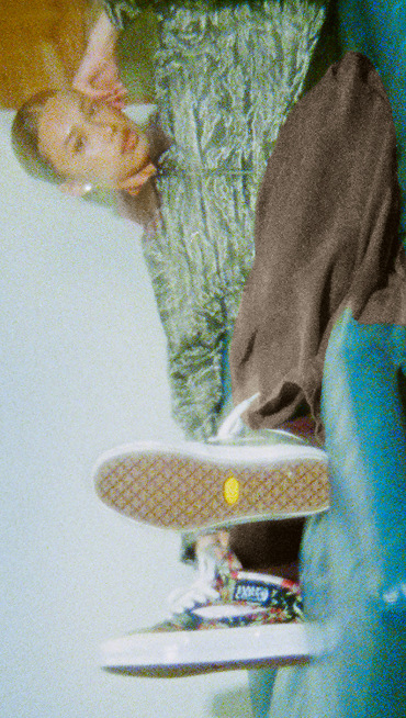 Image of the OTW Halfcab 33 Decon Vibram shoe on top of a black tire