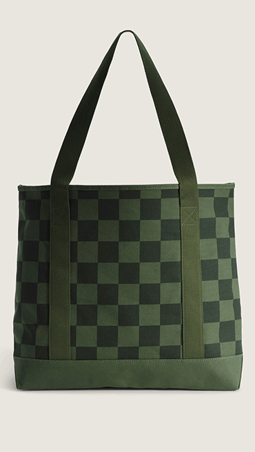 A dark green Pergs Tote Back in a photography studio.