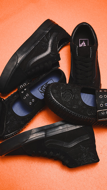 Black Old Skool, Mary Jane Creeper, and Sk8-Hi on an orange surface for Halloween.