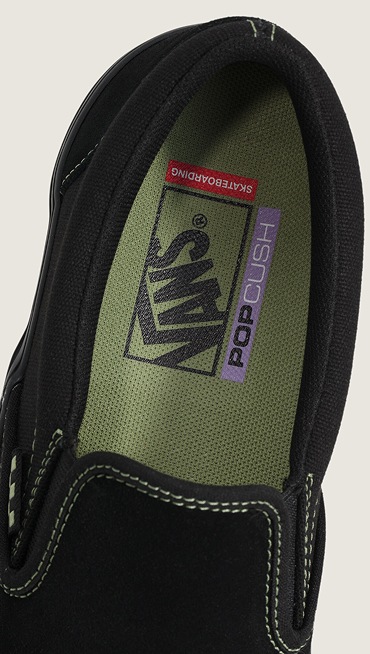 Close-up of the green insole of the Skate Classic Slip-On with the Vans logo.