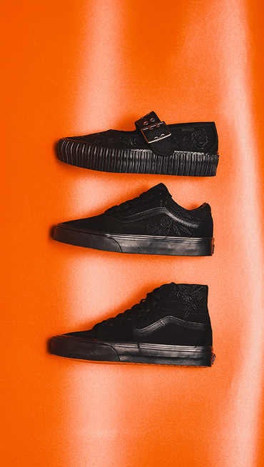 Black Mary Jane, Old Skool, and Sk8-Hi lie on an orange background for a Halloween scene.