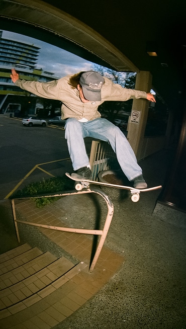 Vans Skate Team Rider Dustin Henry grinds up a staircase rail wearing black Skate Old Skool.