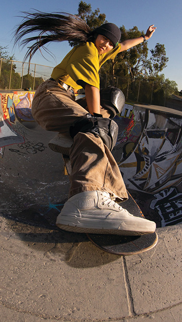 Vans Skate Team Rider Cocona Hiraki catching the lip of a bowl wearing the Skate Half Cab Wafflecup.