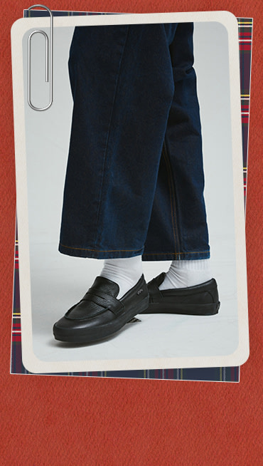 A photograph of the black Skate Loafer on a red and white holiday border.