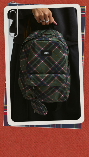 A photograph of a mauvewood MTE Hillgate Cropped Vest and a pine forest Old Skool Mini Backpack on a red and white holiday border.