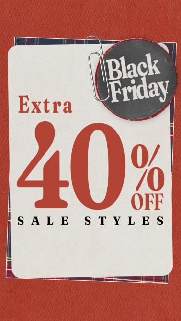 A tag that says extra 40% off sale styles with a paperclipped button that reads Black Friday on a red background.