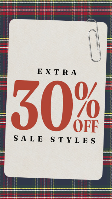 A paperclipped card that says Extra 30% Off Sale Styles on a plaid holiday background.
