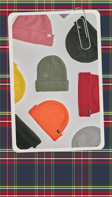 A paperclipped card with an image of various colorways of Vans beanies on a plaid holiday background.