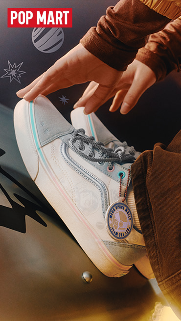 Someone touching their toes wearing the Vans and Space Molly collaboration Old Skool paired with brown pants and a space background.