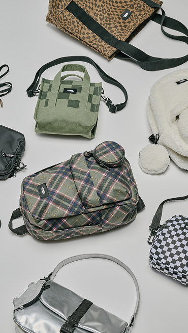 Image of totes, bags, and backpacks scattered on the floor.