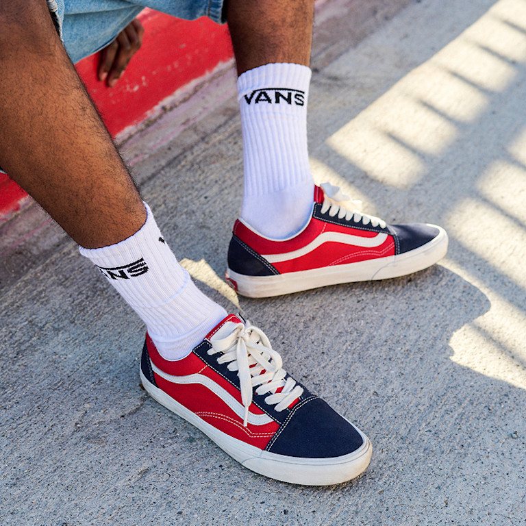 A close up of vans red and black checkerboard shoes
