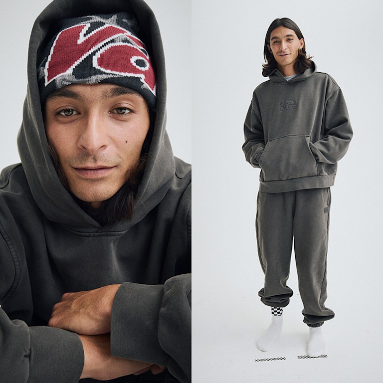 Split image. Left, man wearing a Vans Skull Beanie in Faded Black. Right, Man wearing a Premium Pullover Hoodie in Faded Black with matching sweats.