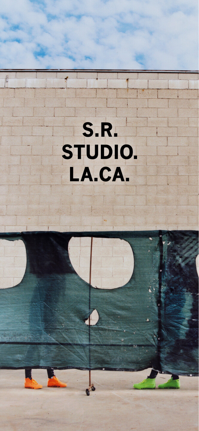 OTW by Vans X Sterling Rudy sk8 hi shoes in orange and green behind a tarp