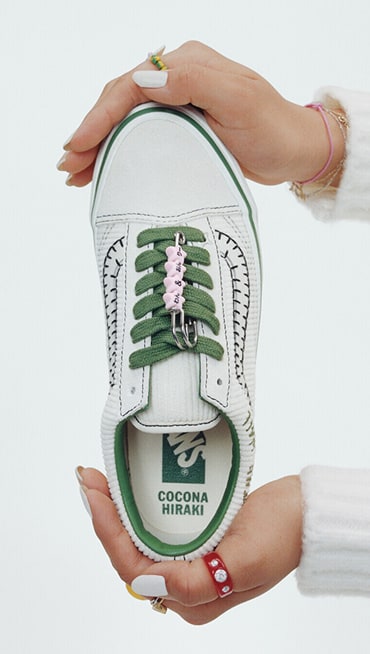 Vans Skater Cocona Hiraki poses in a photography studio wearing all white and her Premium Old Skool from the New Future collection.