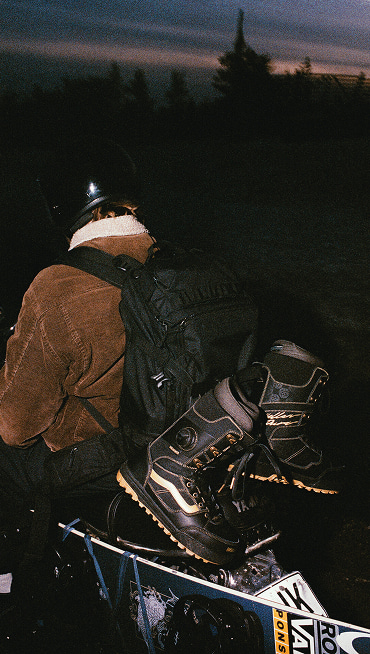 A pair of Invado Pro hanging on a backpack at night.