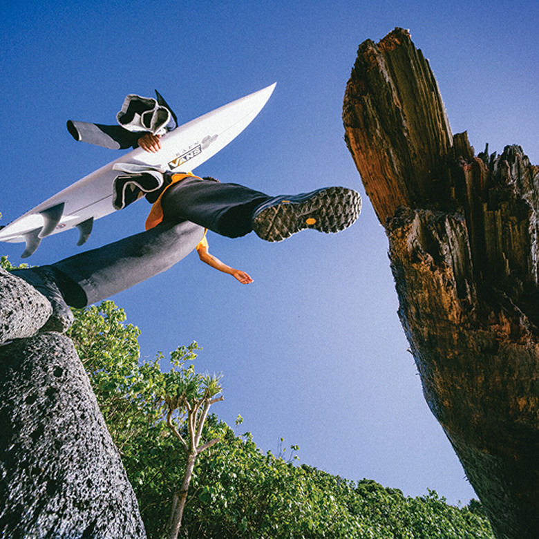 Vans Surf Team Riders Maddie Miller and Micky Clarke crossing a pedestrian bridge wearing the UltraRange 2.0.
