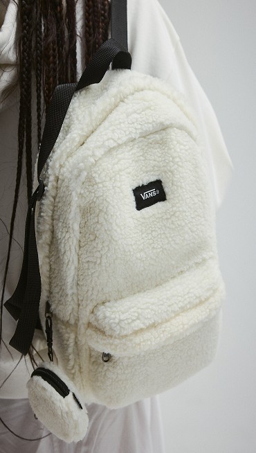 Close-up on the fuzzy texture on the marshmallow white Old Skool Mini Backpack.