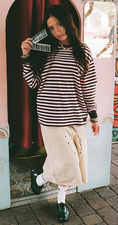 Image of a young woman posing in OTW Oxford SL shoes