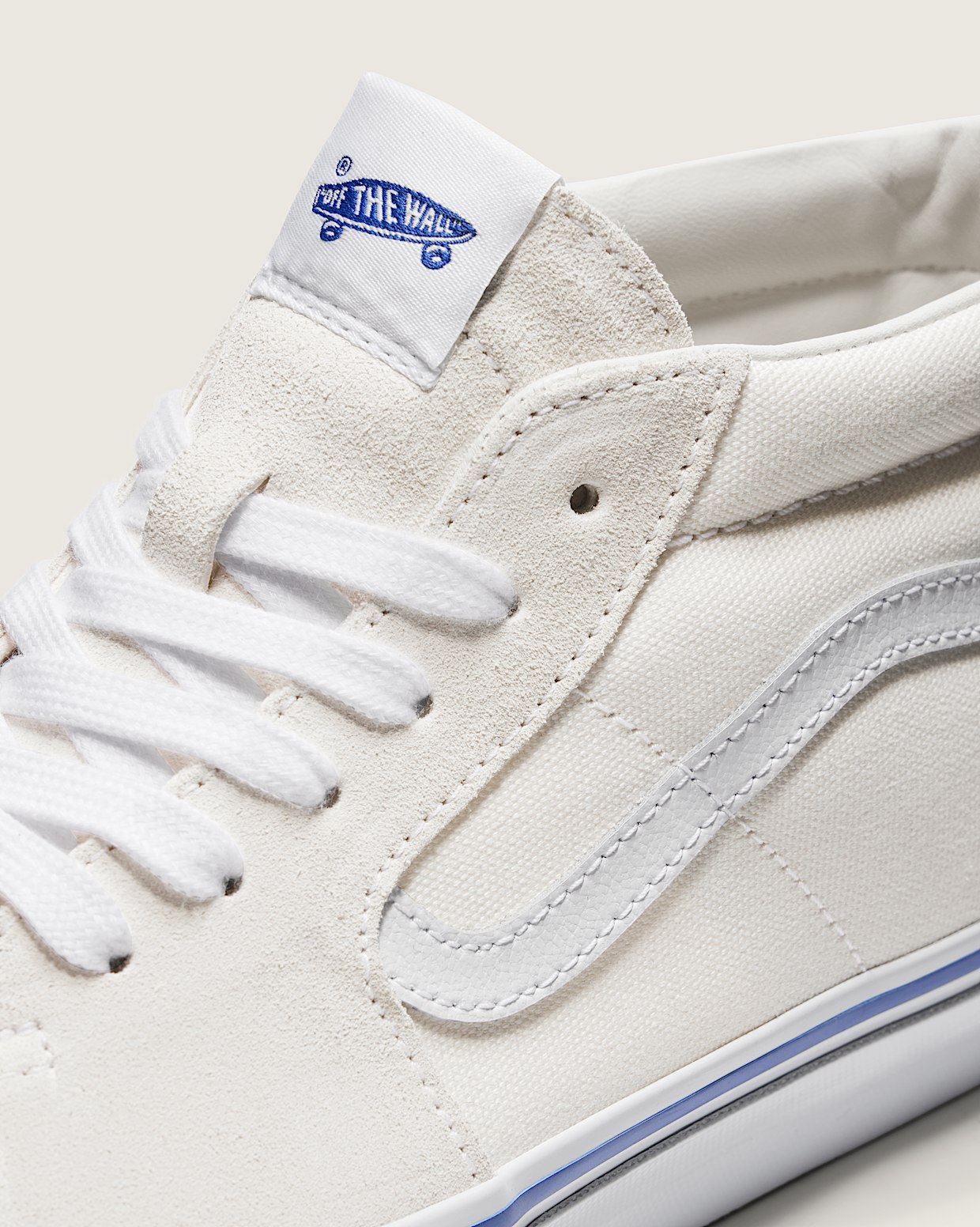 Off white vans with blue stripe hot sale